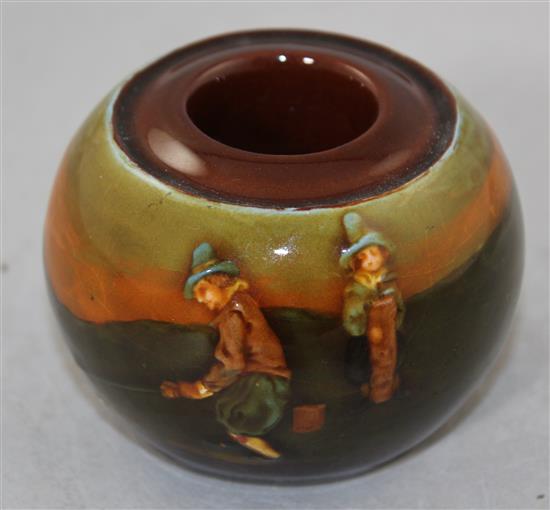 A Royal Doulton Kingsware golfing globular match stand, early 20th century, diam. 8.5cm